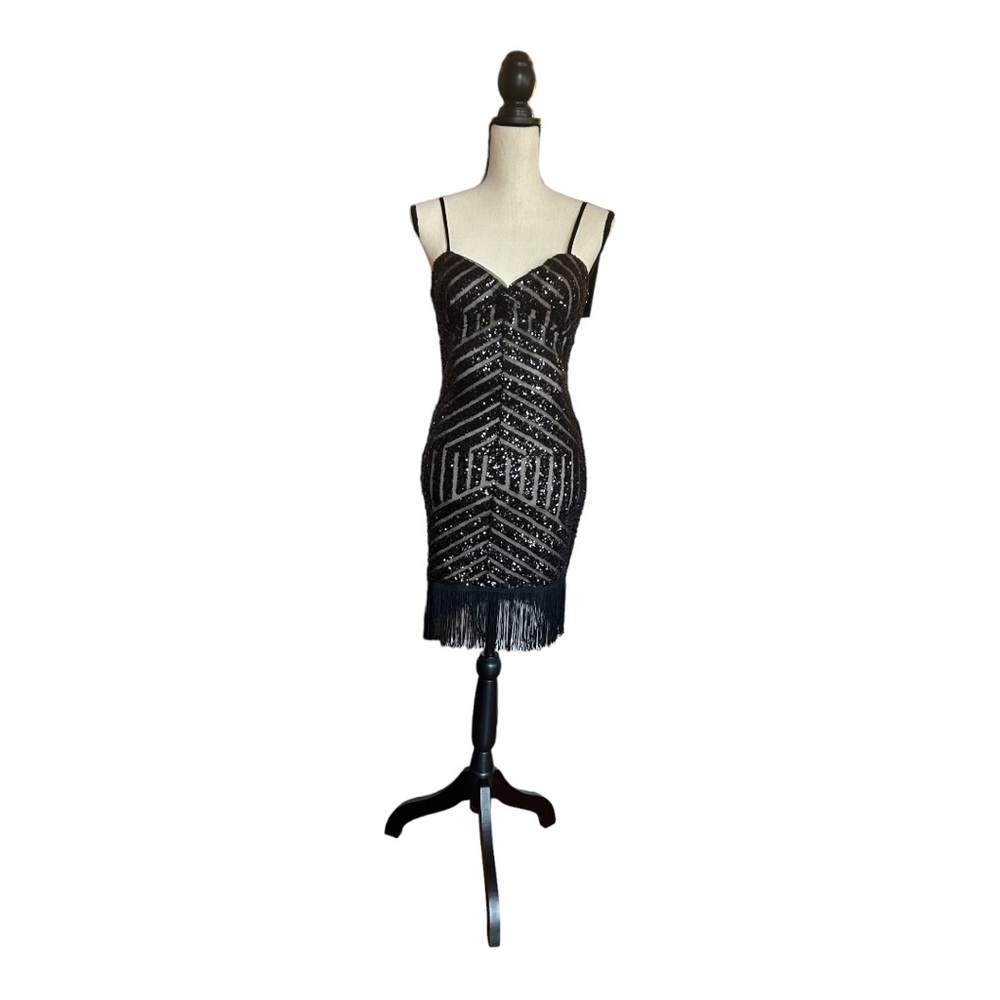Xscape black and nude cocktail dress
Size:4